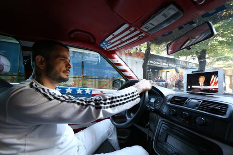 Uljan Kolgjegja keeps an Ipad with a picture of US Republican candidate Donald Trump in his car. (Photo: AP)