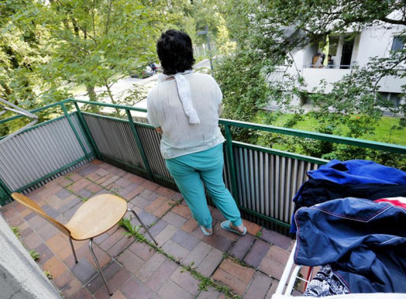 Yazidi girl Yasmin stands on the balcony of her home in Germany. (Photo: AP)