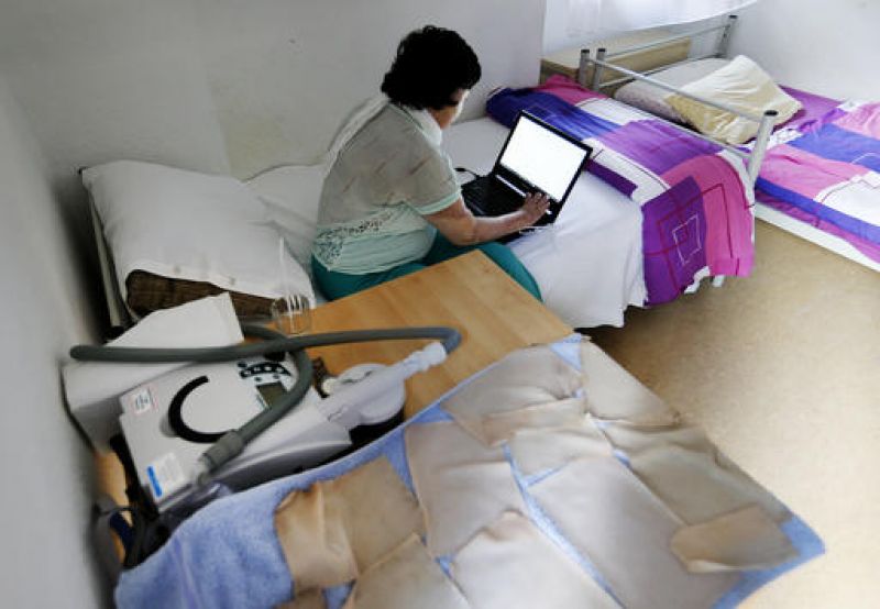 17-year-old Yazidi girl Yasmin sits in a room of her home in Germany. (Photo: AP)