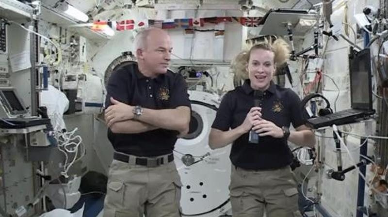 NASA, astronaut Kate Rubins, right, speaks during an interview aboard the International Space Station . At left is Expedition 48 Commander Jeff Williams. Rubins will attempt to complete the first full-blown DNA decoding, or “sequencing,â€in orbit. NASA, astronaut Kate Rubins, right, speaks during an interview aboard the International Space Station . At left is Expedition 48 Commander Jeff Williams. Rubins will attempt to complete the first full-blown DNA decoding, or “sequencing,â€in orbit.