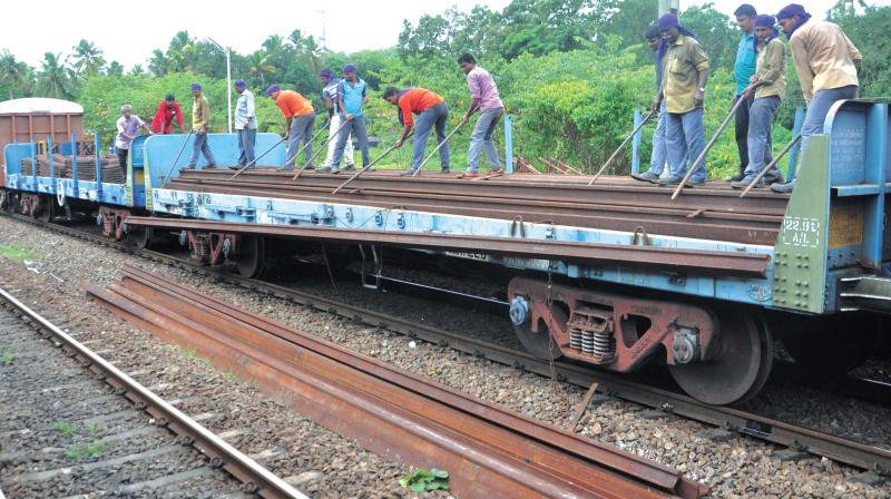New tracks being brought to replace the damaged ones at Karukutty on Sunday. 	(Photo: SUNOJ NINAN MATHEW)