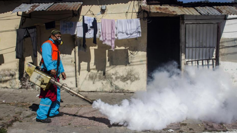 A city worker fumigates to combat the Aedes Aegypti mosquitoes that transmit the Zika virus, at the San Judas Community in San Salvador, El Salvador. (Photo: AP)