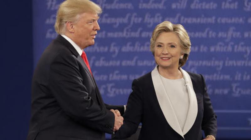 Republican presidential nominee Donald Trump shakes hands with Democratic presidential nominee Hillary Clinton during the second presidential debate at Washington University in St. Louis. (Photo: AP)