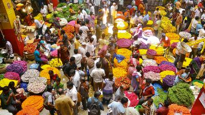 People buying flowers on the eve of Ugadi at City Market in Bengaluru on Thursday 	—DC