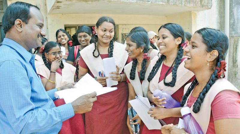 Students of Egmore Presidency Girls Higher Secondary School discuss the mathematics paper after the exam on Friday. (Photo: DEC