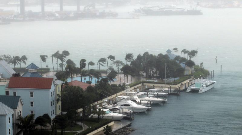 Hurricane Matthew moves through Paradise Island, backdropped by Paradise Island bridge in Nassau, Bahamas, on Thursday. (Photo: AP) Hurricane Matthew moves through Paradise Island, backdropped by Paradise Island bridge in Nassau, Bahamas, on Thursday. (Photo: AP)