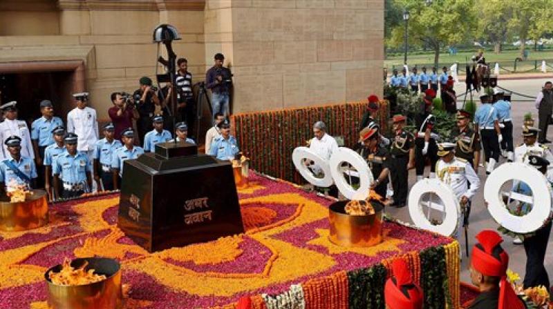 Defence Minister Manohar Parrikar along with the Chief of Army Staff, General Dalbir Singh Suhag,Naval Chief, Admiral Sunil Lanba and Chief of the Air Staff and Air Chief Marshal Arup Raha paying homage at Amar Jawan Jyoti on the occasion of Kargil Vijay Diwas. (Photo: PTI)