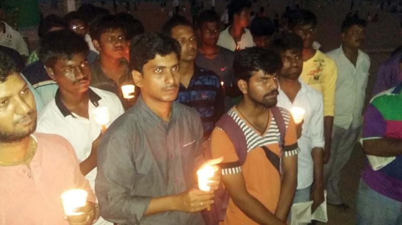Students during a candle light rally at Besant Nagar beach in Chennai on Sunday. (Photo: DC)