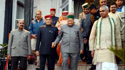 Governor of Himachal Pradesh Acharya Devvrat, Chief Minister Virbhadra Singh and Leader of Opposition Prem Kumar Dhumal at Raj Bhawan in Shimla. (Photo: PTI)
