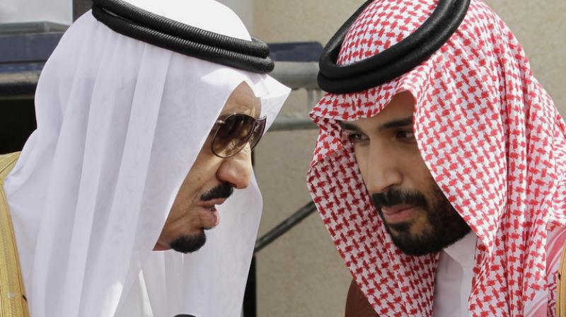 King Salman bin Abdul-Aziz Al Saud (L) speaks with his son Prince Mohammed in Riyadh, Saudi Arabia. (Photo: AP)