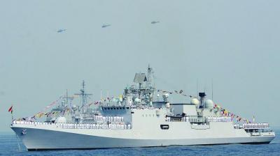 Chetak choppers of Indian Navy fly past the Talwar-class frigate of Indian Navy, INS Teg, during the International Fleet Review in Visakhapatnam on Saturday. (Photo — DC)