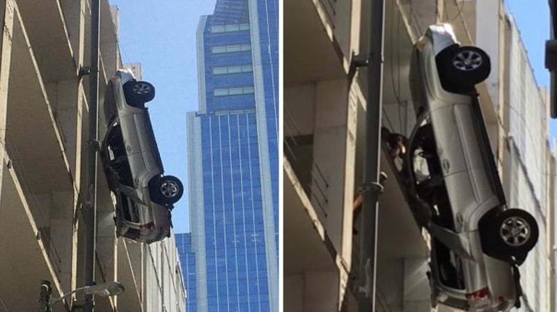 The video shows bystanders trying to rescue the driver of the SUV after the vehicle plunged off the high rise parking garage. The video shows bystanders trying to rescue the driver of the SUV after the vehicle plunged off the high rise parking garage.