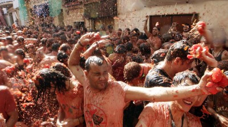 Revellers paint Spanish town red at annual Tomatina festival