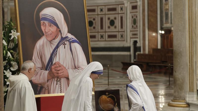 Nuns of Mother Teresas Missionaries of Charity, carry some of her relics during a vigil of prayer in preparation for the canonization of Mother Teresa in the St. John in Latheran Basilica at the Vatican. (Photo: AP)