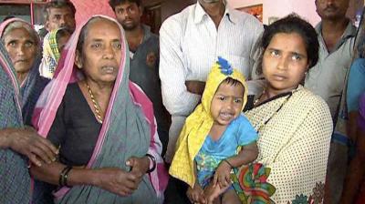 Lance Naik Hanumanthappa Koppad's mother and wife at their home in Betadoor village in Hubli. (Photo: PTI)