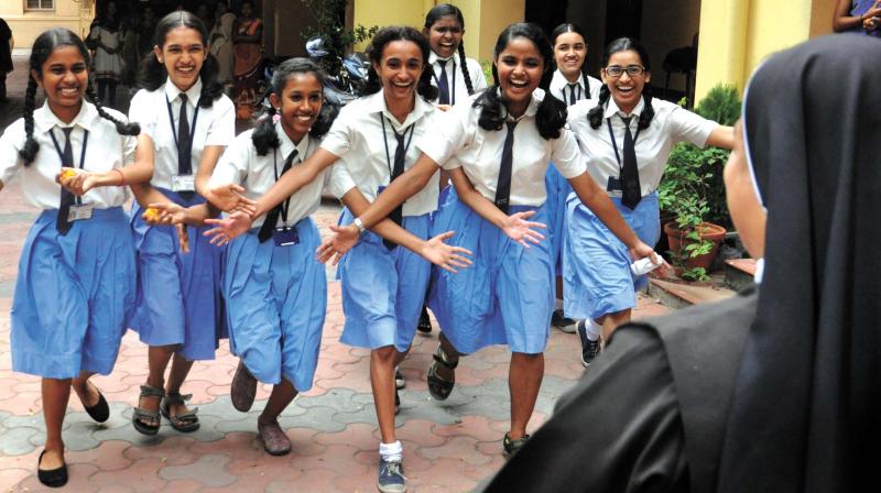 Students rush to greet St Teresas Higher Secondary School headmistress Sr Maji after the SSLC results were declared on Wednesday.  (Pic: sunoj ninan mathew)