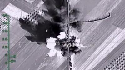 An aerial image shows what it says is a column of heavy trucks carrying ammunition hit by a Russian air strike near Aleppo in Syria. (Photo: AP)