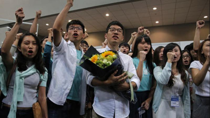 Pro-democracy supporters celebrates after winning a seat at the legislative council elections in Hong Kong. (Photo: AP) Pro-democracy supporters celebrates after winning a seat at the legislative council elections in Hong Kong. (Photo: AP)