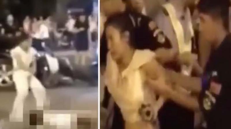 A video footage captured by a CCTV camera shows a woman driver speeding on a road in Shandong province's Zoucheng county and running over a pedestrian. (Photo: YouTube Video Grab) A video footage captured by a CCTV camera shows a woman driver speeding on a road in Shandong province's Zoucheng county and running over a pedestrian. (Photo: YouTube Video Grab)