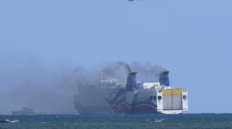 Smokes spills from the the cruise ship Caribbean Fantasy off the coast of San Juan, Puerto Rico. (Photo: AP) Smokes spills from the the cruise ship Caribbean Fantasy off the coast of San Juan, Puerto Rico. (Photo: AP)