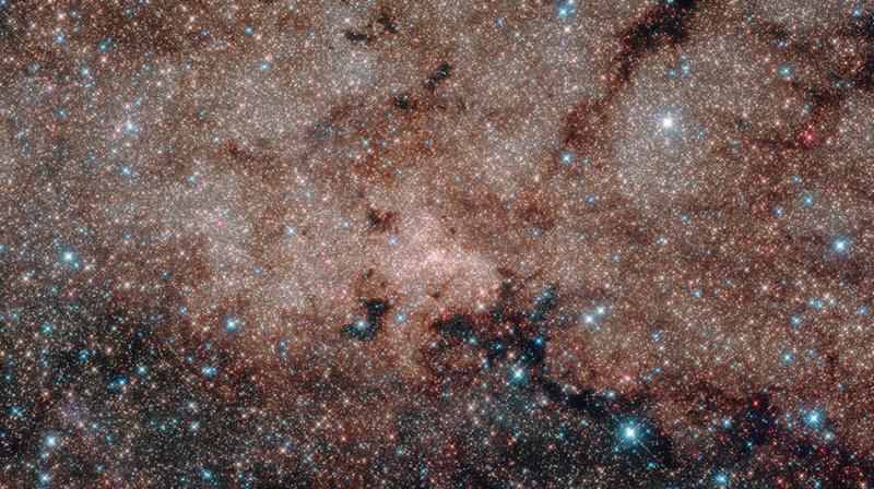 Researchers are surveying the sky around massive galaxy clusters that are the right size and distance away to focus light from very distant galaxies Researchers are surveying the sky around massive galaxy clusters that are the right size and distance away to focus light from very distant galaxies