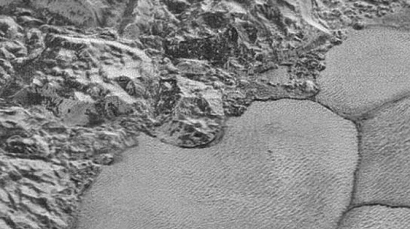 Close-up shot of Pluto’s surface (Photo: NASA) Close-up shot of Pluto’s surface (Photo: NASA)