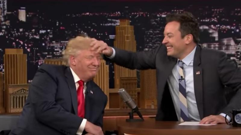 Nothing fell off with Fallon's intervention but the result was not very pretty as Trump's long locks ended up pointing messily every which way. (Photo: Videograb) Nothing fell off with Fallon's intervention but the result was not very pretty as Trump's long locks ended up pointing messily every which way. (Photo: Videograb)