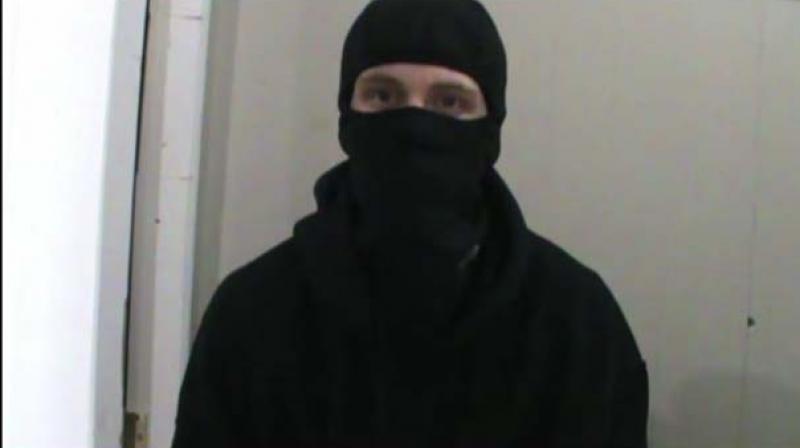 In the video, a man in a black balaclava cites a phrase from the Koran, refers to crimes against Muslims and pledges an imminent attack on a Canadian city. (Photo: YouTube Video Grab) In the video, a man in a black balaclava cites a phrase from the Koran, refers to crimes against Muslims and pledges an imminent attack on a Canadian city. (Photo: YouTube Video Grab)