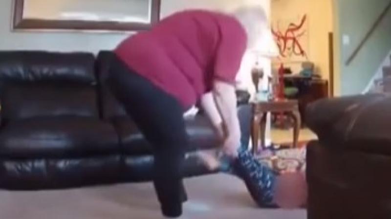 A video grab showing Lillian dragging the child across the drawing room. A video grab showing Lillian dragging the child across the drawing room.
