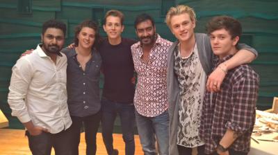 Ajay Devgn and Mithoon with The Vamps.,