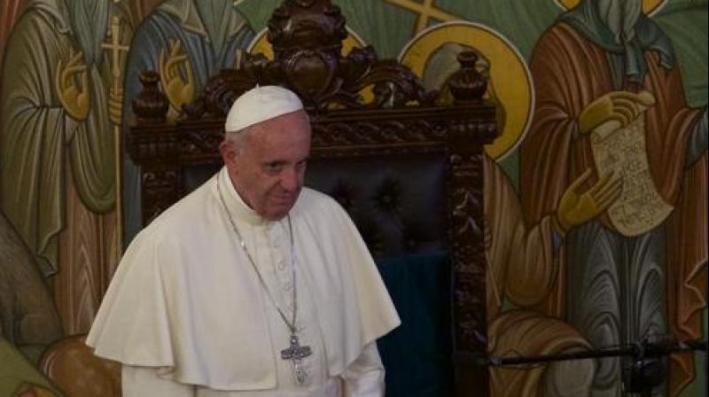 Pope Francis takes a seat during his meeting with Georgian Orthodox Patriarch Iliya II. (Photo: AP) Pope Francis takes a seat during his meeting with Georgian Orthodox Patriarch Iliya II. (Photo: AP)