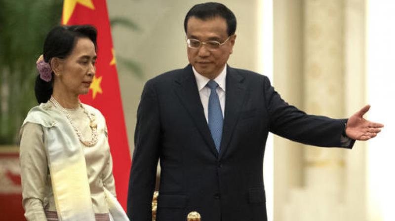 China's Premier Li Keqiang with Myanmar's State Counselor Aung San Suu Kyi during a welcome ceremony at the Great Hall of the People in Beijing. (Photo: AP) China's Premier Li Keqiang with Myanmar's State Counselor Aung San Suu Kyi during a welcome ceremony at the Great Hall of the People in Beijing. (Photo: AP)