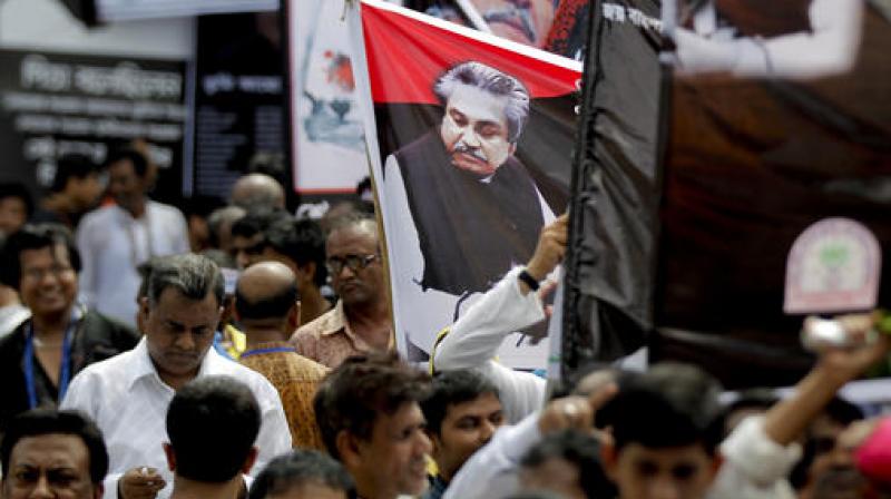 Hundreds of people followed the Bangladeshi leaders in paying tribute, and recalling the horror when 32 people were killed as a group of rogue soldiers staged a coup in 1975. (Photo: AP) Hundreds of people followed the Bangladeshi leaders in paying tribute, and recalling the horror when 32 people were killed as a group of rogue soldiers staged a coup in 1975. (Photo: AP)