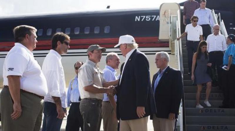 Donald Trump is is greeted by Louisiana officials upon his arrival at the Baton Rouge airport in Baton Rouge. (Photo: AP) Donald Trump is is greeted by Louisiana officials upon his arrival at the Baton Rouge airport in Baton Rouge. (Photo: AP)